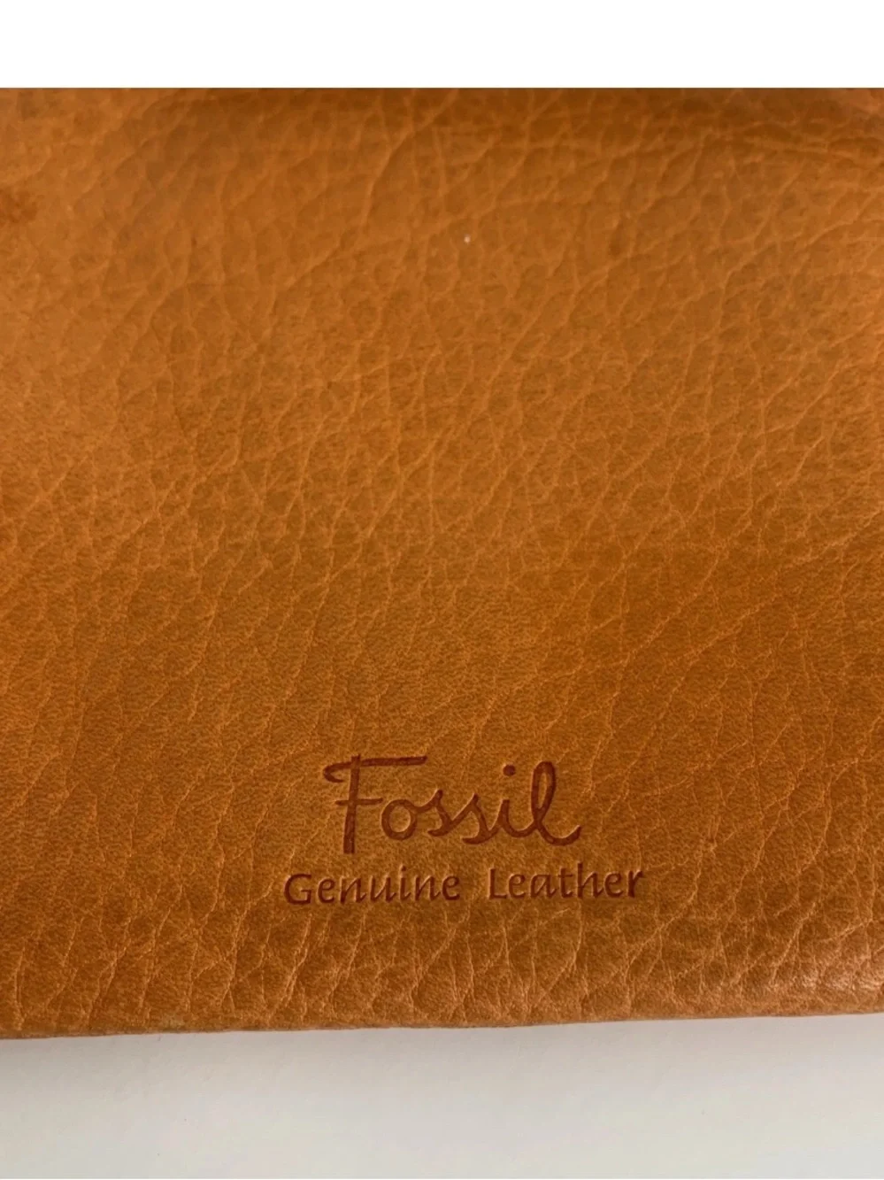 Fossil leather wristlet